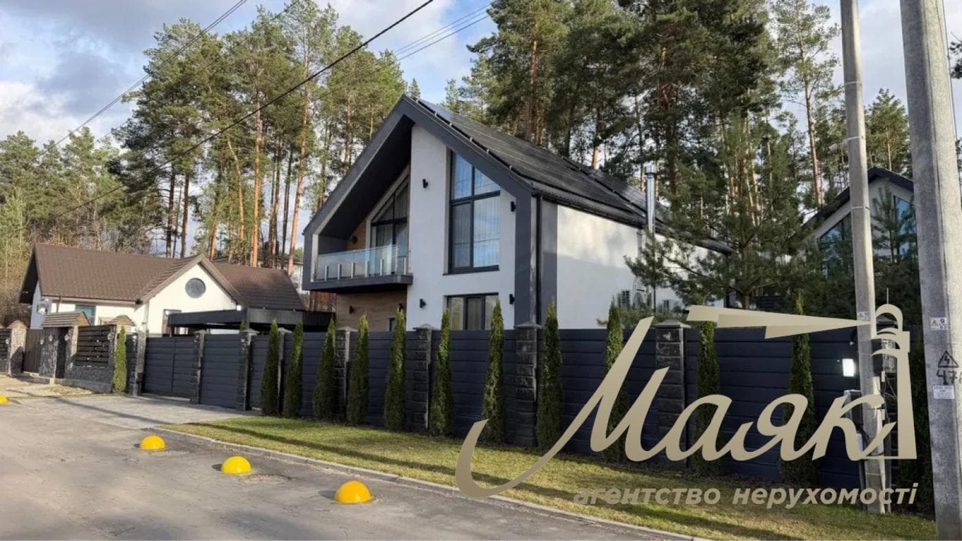 A stylish two-story house is for sale in a cozy wooded area in the village of Khodosivka—the perfect place for those who appreciate peace and quiet, nature, and the comforts of modern life.