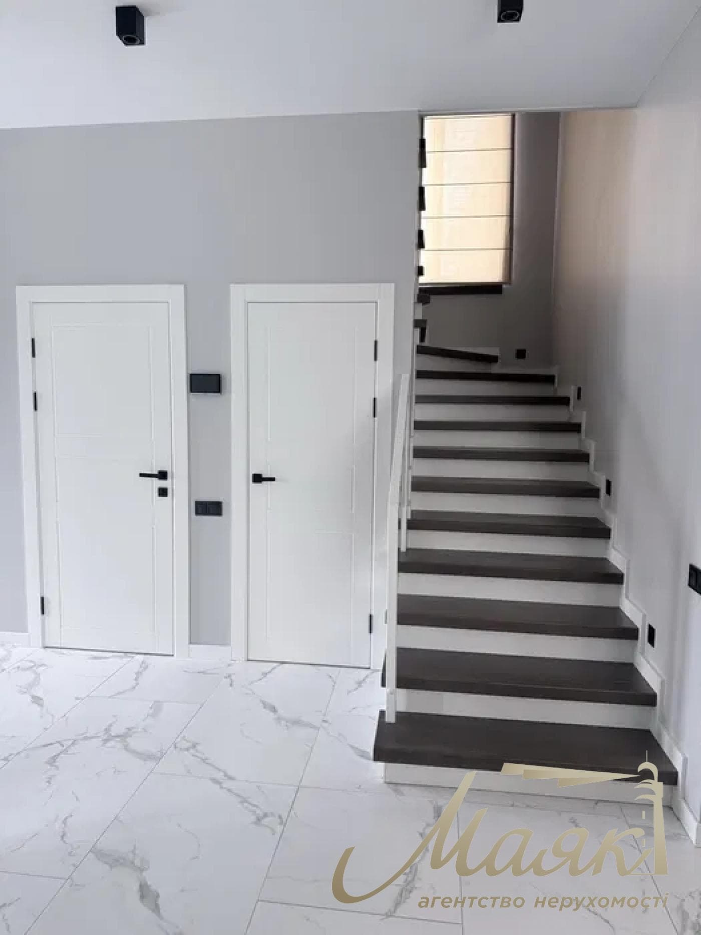 A stylish two-story house is for sale in a cozy wooded area in the village of Khodosivka—the perfect place for those who appreciate peace and quiet, nature, and the comforts of modern life.
