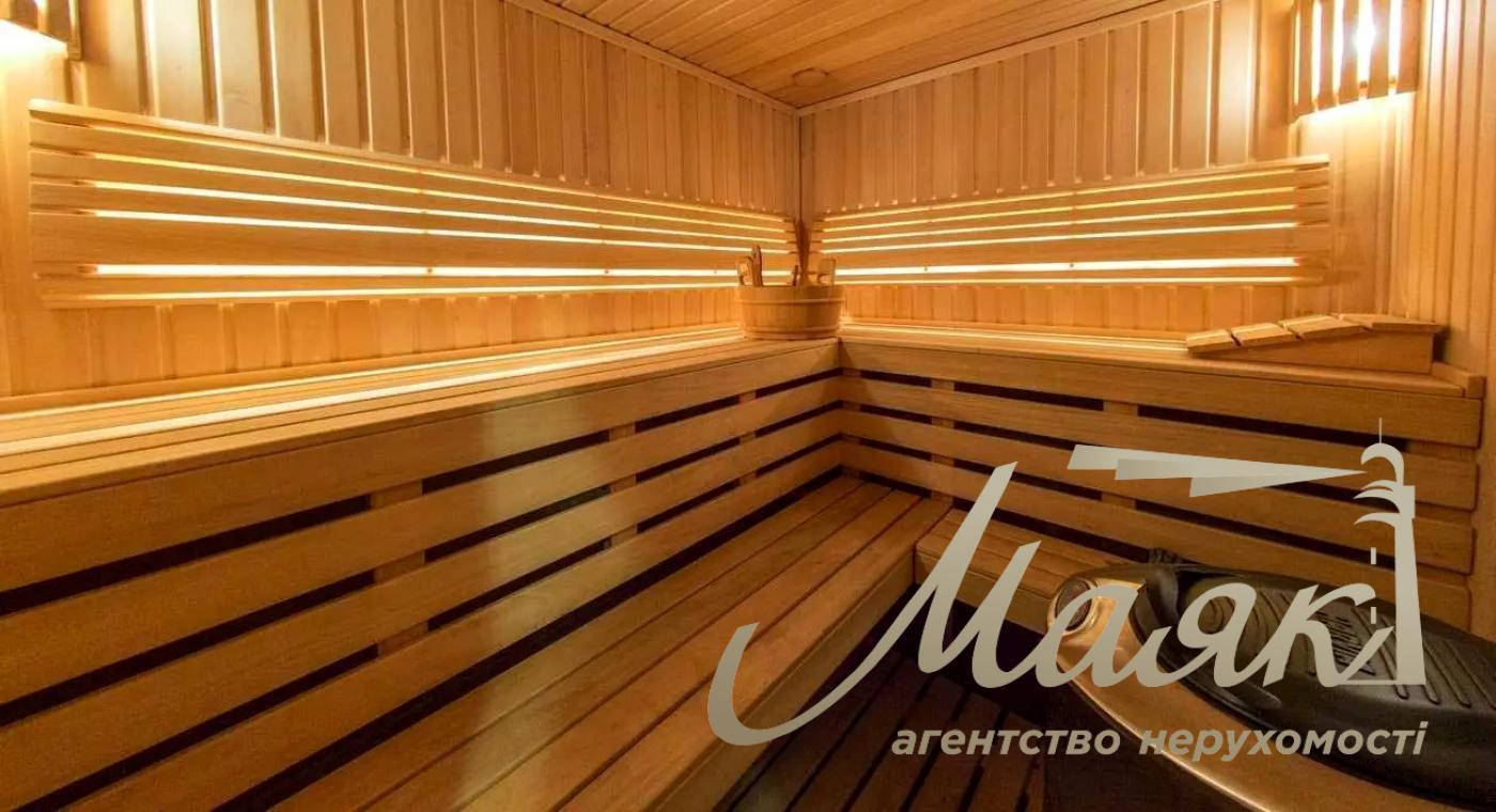 Оренда будинку площею 430 м², що розташований у сосновому лісі на ділянці 50 соток із ландшафтним дизайном у с. Романків.