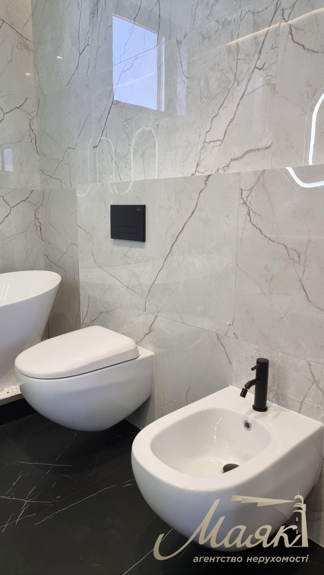 Продаж нового сучасного будинку в стилі Hi-Tech у селі Гатне